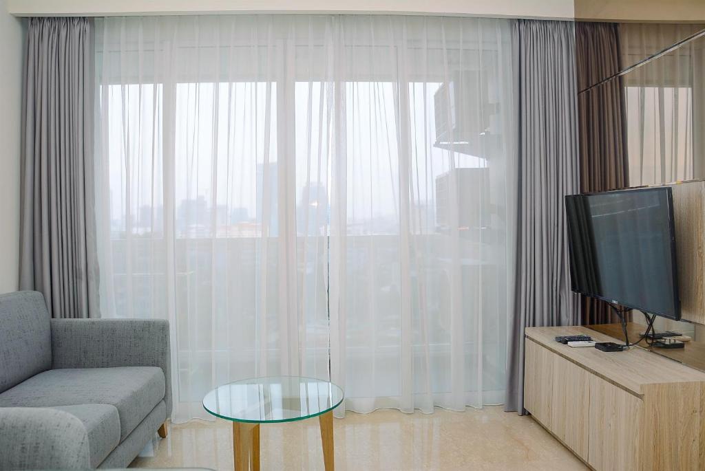 Strategic Best View @ 2BR Menteng Park Apartment By Travelio 1