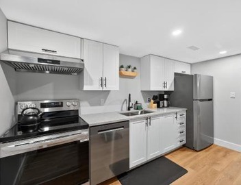 Bright and Modern 2BR Suite with Rustic Bar 3