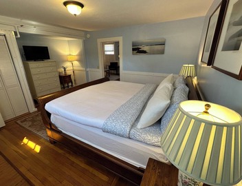 Dive into downtown Newport RI in this private, large, unique townhouse-style 2BR apartment at 205 Spring St! King and Full beds + pull-out sofa full kitchen, 2 baths, outdoor patio, AC, TVs, Wifi. Just steps to Thames Street, shops and wharfs 5