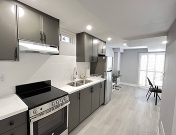 One bedroom ensuite toilet on main level & kitchen, living, bathroom lower level 2
