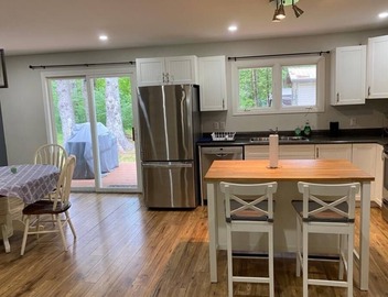 River front 4 season cottage with 2.5 acre serenity with mature trees around 3