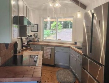 Spacious, waterfront home surrounded by trees with large dock & games room. 5