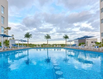 Suite Near Cancún Airport | Outdoor Pool, Free Shuttle, Breakfast & Kitchenette 5