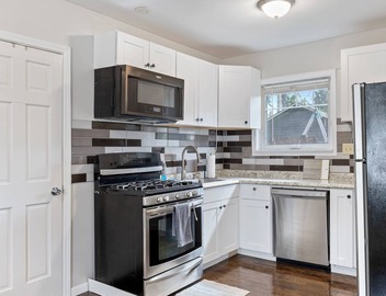 Super Sleek large Tiny house by Westmont Metra large enclosed yard and parking. 3