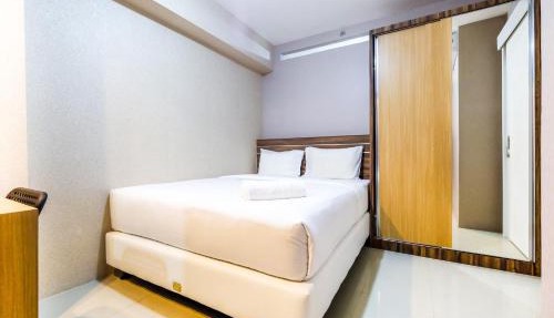 Classic 2BR Bassura City Apartment By Travelio