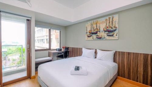 Comfortable Pool View Studio Room at Gateway Park LRT City Jatibening Apartment By Travelio