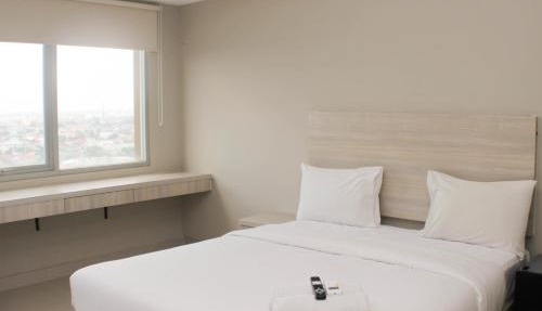 Cozy Studio at Gateway Park LRT City Jatibening Apartment By Travelio