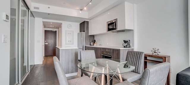 Downtown 2BR Gem with Balcony and Skyline Views