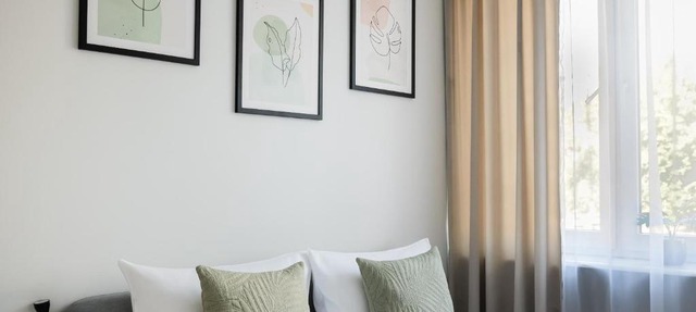 Nowogrodzka Grey Apartment by BookingHost