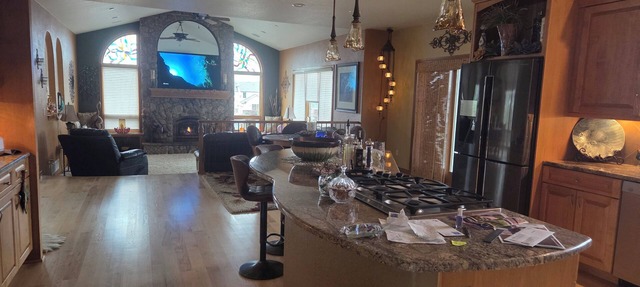 Oversized three car garage, huge barn, beautiful pond, grill on upper deck.