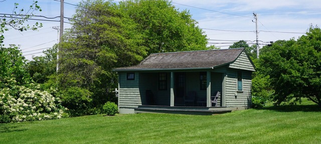Sakonnet Point water view cottage with 8 minute walk to idyllic private beach .