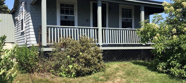 Sakonnet Point water view cottage with 8 minute walk to idyllic private beach .
