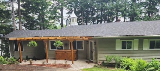 Spacious, waterfront home surrounded by trees with large dock & games room.
