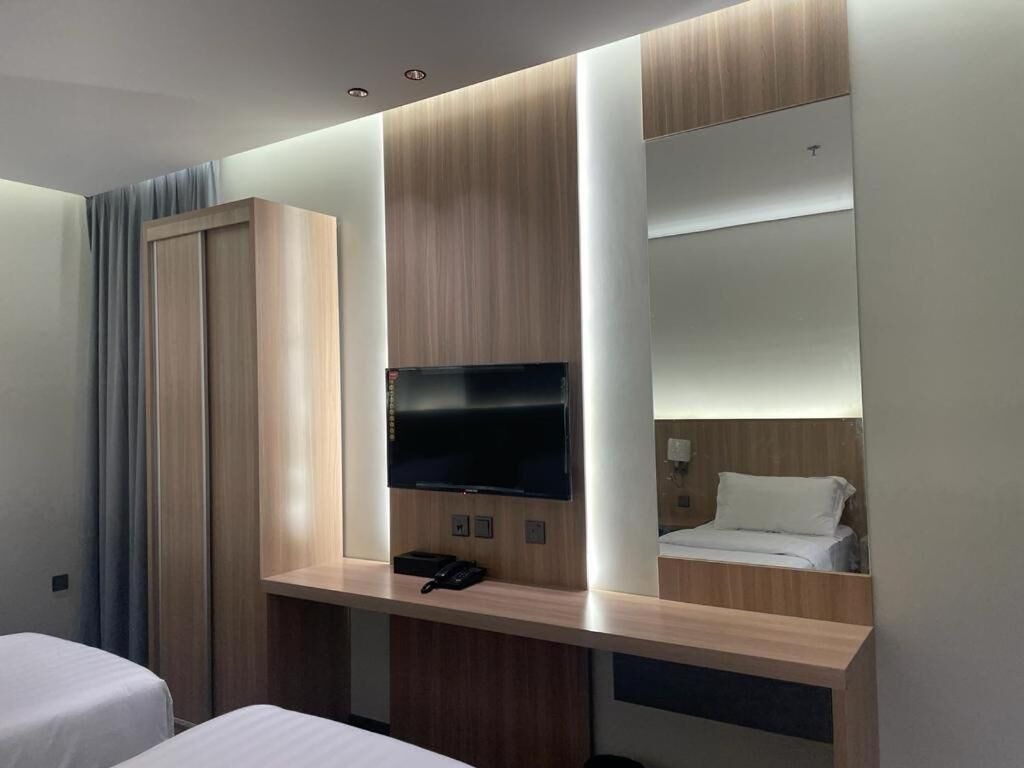 Cozy 1-bedroom hotel with AC, WiFi in charming Makkah 1