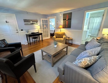 Dive into downtown Newport RI in this private, large, unique townhouse-style 2BR apartment at 205 Spring St! King and Full beds + pull-out sofa full kitchen, 2 baths, outdoor patio, AC, TVs, Wifi. Just steps to Thames Street, shops and wharfs 4