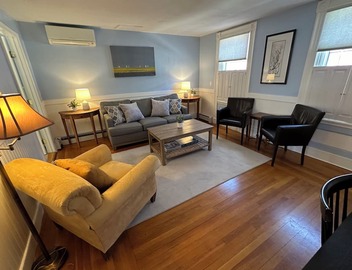 Dive into downtown Newport RI in this private, large, unique townhouse-style 2BR apartment at 205 Spring St! King and Full beds + pull-out sofa full kitchen, 2 baths, outdoor patio, AC, TVs, Wifi. Just steps to Thames Street, shops and wharfs 2