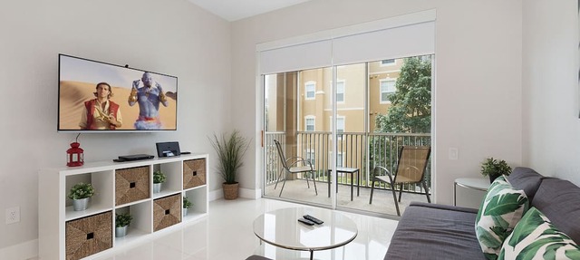 Modern condo in resort, 5 min to Disney. WiFi, water slides, pool, arcade!
