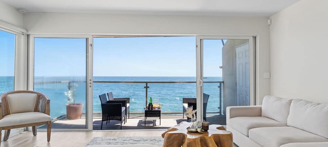 Oceanfront Retreat with Multiple Balconies, Direct Beach Access & Sweeping Views