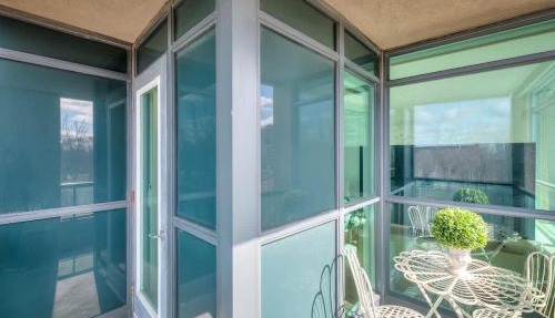 1BR Den Lake Facing Condo with Balcony & Parking